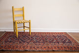 Vintage Tribal Belouch rug, vibrant madder root red and deep indigo blue geometric patterns.