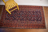 Vintage Tribal Belouch rug with tribal geometric patterns, madder red, indigo, and fringe.