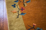 Vintage Chinese Art Deco rug detail: mustard gold field with lime green border, blooming tendrils.