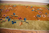 Art Deco Chinese rug detail, budding flowers, scrolling tendrils, mustard gold and lime green.