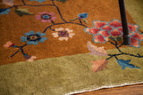 Mustard and lime green Art Deco rug border with vibrant floral and scrolling tendril design.