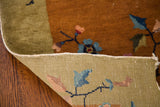 Hand-knotted vintage Chinese Art Deco rug corner, revealing mustard gold pile and green woven foundation.