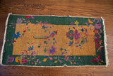 Corner detail of 1920s Art Deco Chinese rug with butterfly, floral motifs, exposed knots.