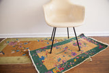 1920s Art Deco Chinese rug, gold field, green border, colorful floral and bird motifs, exposed knots.