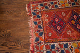 Vintage Turkish rug border: alternating geometric patterns, tangerine, saffron, indigo, red.