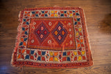 Cheerful vintage Turkish rug with vibrant geometric diamonds and alternating color borders.