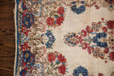 Vintage Kerman rug corner, red and indigo florals on cream, with blue secured edge.