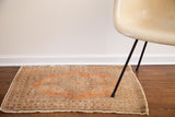 Vintage Tabriz collector rug corner with earthen tones and thick cord selvage.
