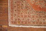 Ornate curvilinear borders in muted rust, bark, and ivory on a vintage Persian Tabriz rug.