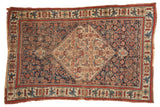 Antique Bijar area rug, prominent ivory medallion with dense indigo and red floral motifs, 5'4