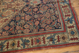 Antique Bijar rug detail: dense indigo field with intricate floral motifs and distinct borders.