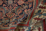 Fine weave and supple fold of the antique Bijar rug, showing its red wool weft.