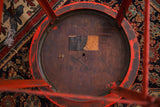 Underside of Industrial Royal Metal stool, highlighting original label and chippy red paint.