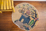 Whimsical Vintage Chinese round rug, cottage and tree motif in blue, green, beige, plum.