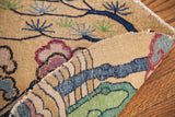 Hand-knotted construction of a whimsical Chinese rug with plum, blue, and green art deco patterns.
