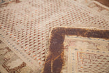 Antique Turkish rug's aged pile and fragile reverse edge with visible adhesive application.