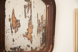 Detail of the 1930s vintage mirror, showing chippy silvering and dark patina.
