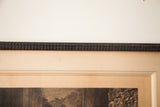 Close-up of the original primitive-style carved wooden frame and aged mat.