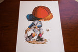 Vintage 1970s 'Lil Slugger' lithograph of a playful cartoon baseball boy.