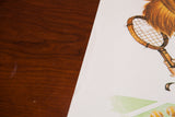 Close-up of the vintage tennis girl art showing the hand-drawn wooden racket.