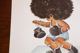 Close-up of the cartoon boxer's textured afro and boxing gloves from the 1970s print.