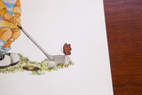 Close-up of the vintage lithograph with a cartoon butterfly on a golf club.