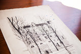 Angled perspective of Irving Nurick etching, highlighting aged paper, blue drops, and bare trees.