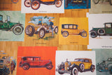 Colorful vintage illustrations of a 1917 Stutz Bearcat and 1918 Chevrolet on the poster.