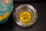 Yellow Sands Hotel Las Vegas logo on clear glass ashtray.