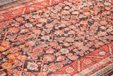 Vintage Hamadan runner with charcoal field, intricate herati pattern, red tangerine border.