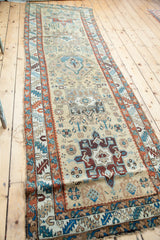 Antique Northwest Persian Karaja runner, tribal geometric motifs on gold beige, accented in teal and madder red.