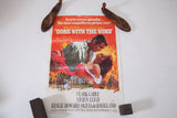 Vintage 1970s Gone With The Wind poster featuring Rhett and Scarlett on fiery red-orange.
