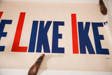 Blue 'IKE' lettering and red stripe on vintage 1950s poster with slight edge wear.