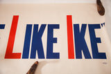 Mid Century 'LIKE IKE' political poster with bold red and blue lettering, visible edge tears.