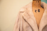 Vintage ivory striped mink fur coat collar and lapel texture.