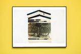 A house-shaped collage print made from an antique photograph of a person with a bicycle.