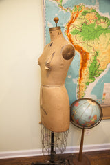 Vintage JR Bauman dress form mid-section with aged canvas and tied waist.