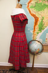 Vintage 50s red plaid day dress, shown in side profile with oversized white collar.