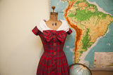 Vintage 50s red plaid dress skirt with a long line of matching red buttons.