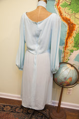 Vintage 70s pale blue chiffon dress, back showing long zipper and sheer skirt.
