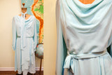 Robin's egg blue chiffon dress's tie belt tied at the waist.