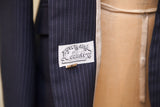 Town and Country equestrian label with horse motif on vintage navy pinstripe blazer.
