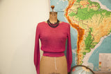 Close-up of the raspberry pink textured knit on the Cashin Country sweater.