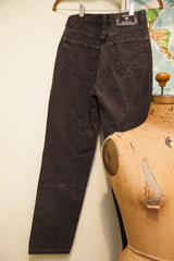 Lower back leg of vintage Versace faded acid wash jeans with slight faded spot.