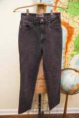 Lower back of faded black Versace Jeans Couture pants with slight faded circle.