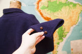 Vintage Navy Blue Slouchy Sweater Jacket sleeve cuff with two brown wooden buttons.