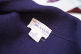 Navy blue wool sweater detail with Deans of Scotland brand label.