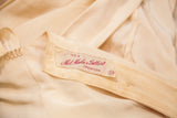 Mel Hahn & Gilbert Creation label on vintage rayon blouse with light fabric stains.