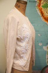 Prominent beaded floral and scattered bead design on the vintage ivory cashmere sweater.