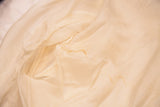 Slight discoloration on inner sleeve of vintage ivory cashmere sweater.